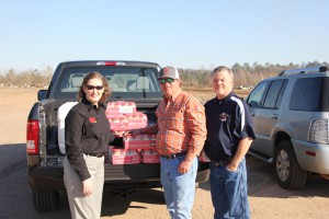 The Georgia Peanut Commission delivers peanut butter to Bullard Farms in Cook County, Georgia. Pictured left to right are Joy Crosby, GPC director of communications, Jason Bullard, farmer from Adel, Ga., and Lamar Ray, director of the Cook County Emergency Management Agency.